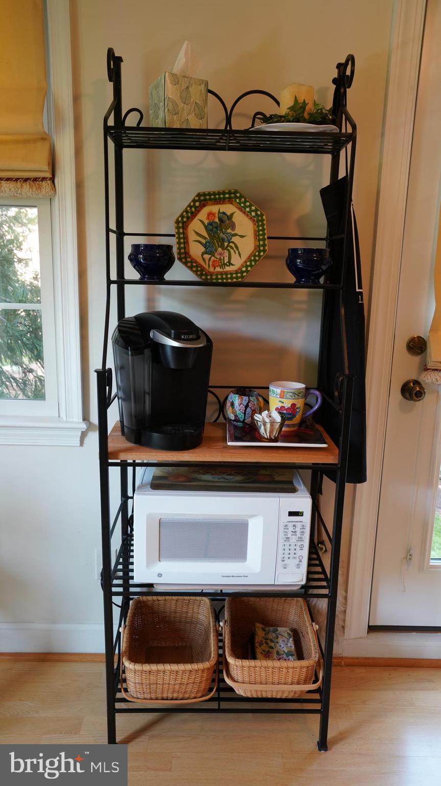 1107 North Pitt Street, Unit 2A Alexandria, VA 22314 - Photo 9 of 32 a room with a fireplace and a table