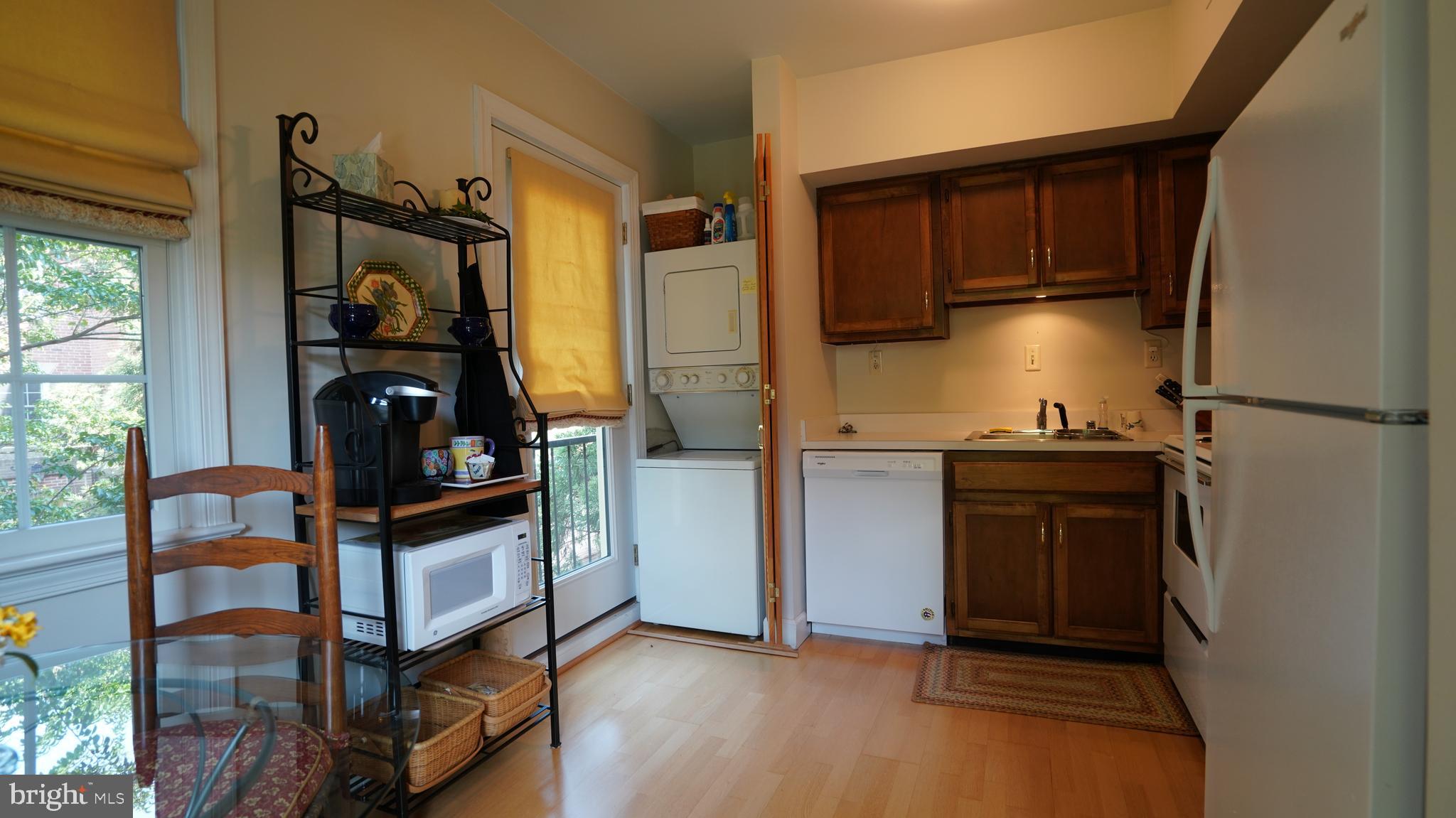 1107 North Pitt Street, Unit 2A Alexandria, VA 22314 - Photo 10 of 32 a view of walk in closet with clothes and shoes