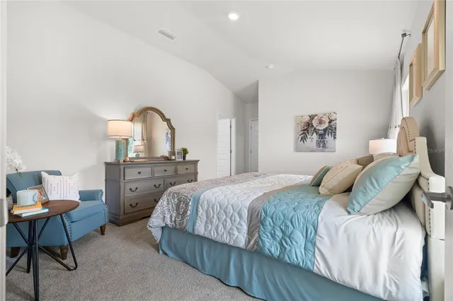 a bedroom with a bed and a table