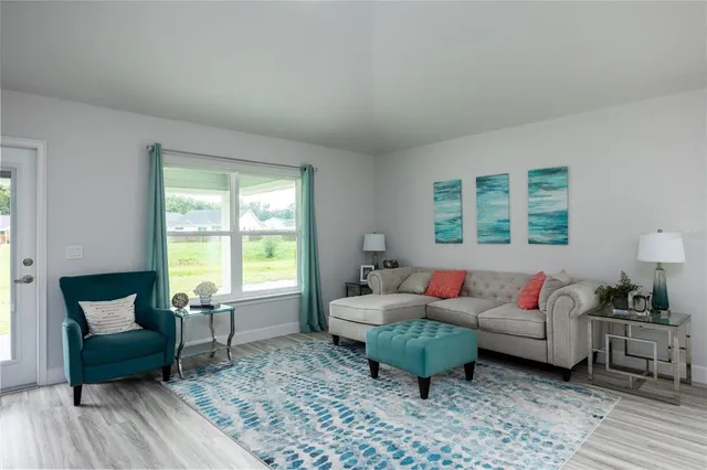 a living room with furniture and a window