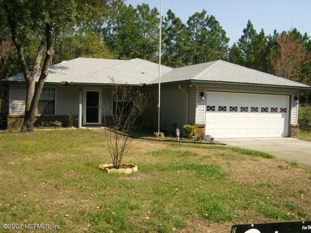 1567 Panther Ridge Court Jacksonville, FL 32225 - Photo 1 of 11 a backyard of a house with barbeque oven