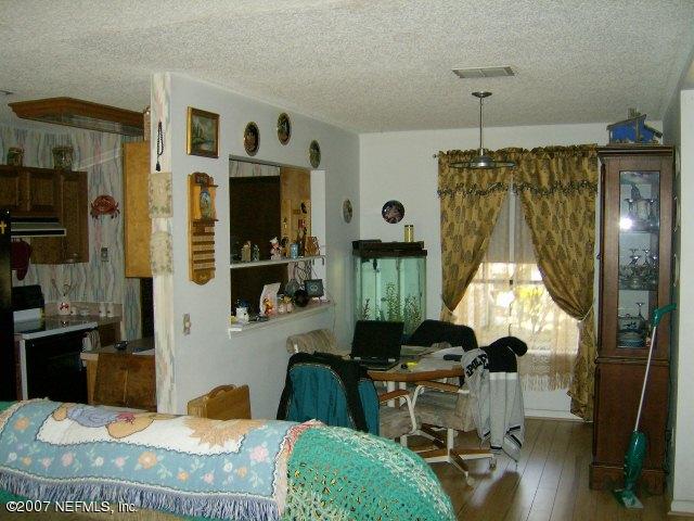 1567 Panther Ridge Court Jacksonville, FL 32225 - Photo 4 of 11 a living room with furniture and a window