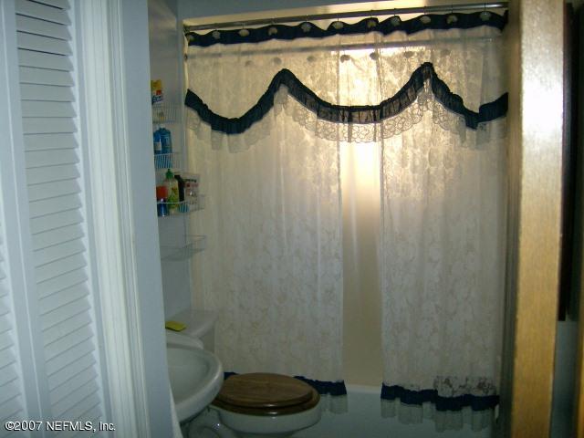 1567 Panther Ridge Court Jacksonville, FL 32225 - Photo 9 of 11 a bathroom with a sink and a mirror