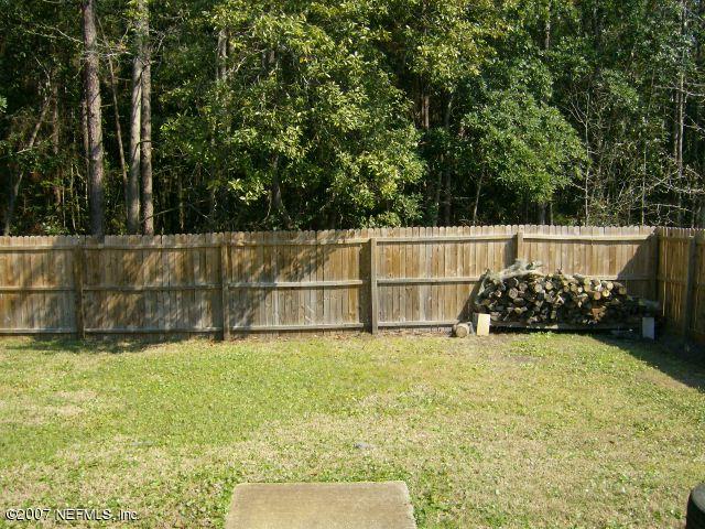 1567 Panther Ridge Court Jacksonville, FL 32225 - Photo 10 of 11 a view of a yard with large trees