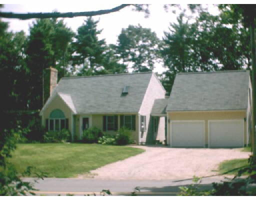 437 Delano Road Marion, MA 02738 - Photo 1 of 1 a front view of a house with a yard and garage
