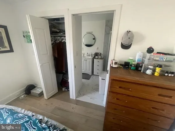 a bathroom with a double vanity sink and mirror