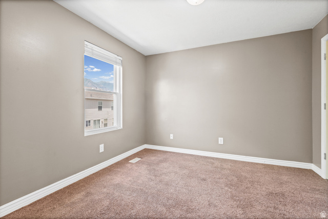 1346 Archmore Drive Springville, UT 84663 - Photo 20 of 32 Neutral-toned room featuring a single window, brown carpet flooring, and white baseboards