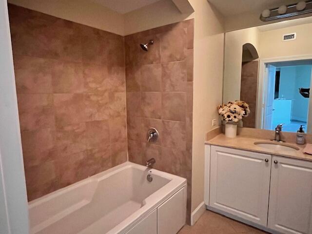 1690 Renaissance Commons Boulevard, Unit 1522 Boynton Beach, FL 33426 - Photo 12 of 31 a bathroom with a tub sink and mirror
