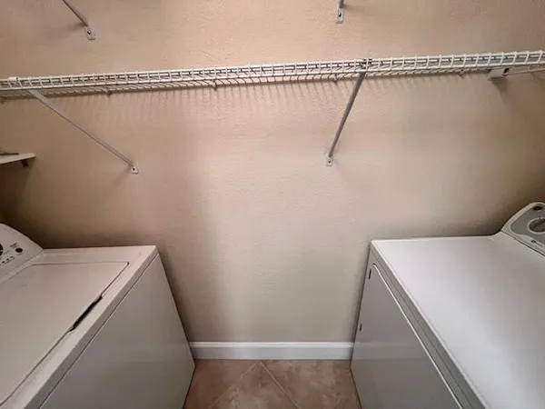 a utility room with dryer and washer
