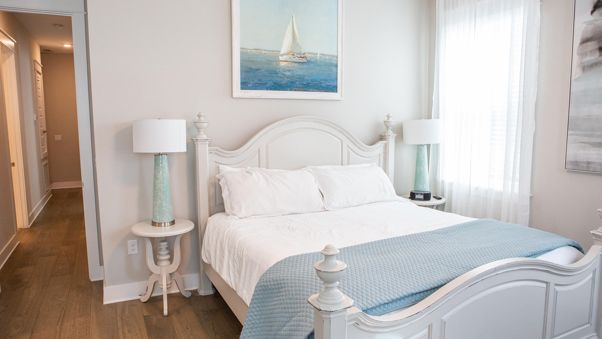 51 Dune Comet Lane, Unit A Panama City Beach, FL 32461 - Photo 12 of 63 a bedroom with a bed and a lamp