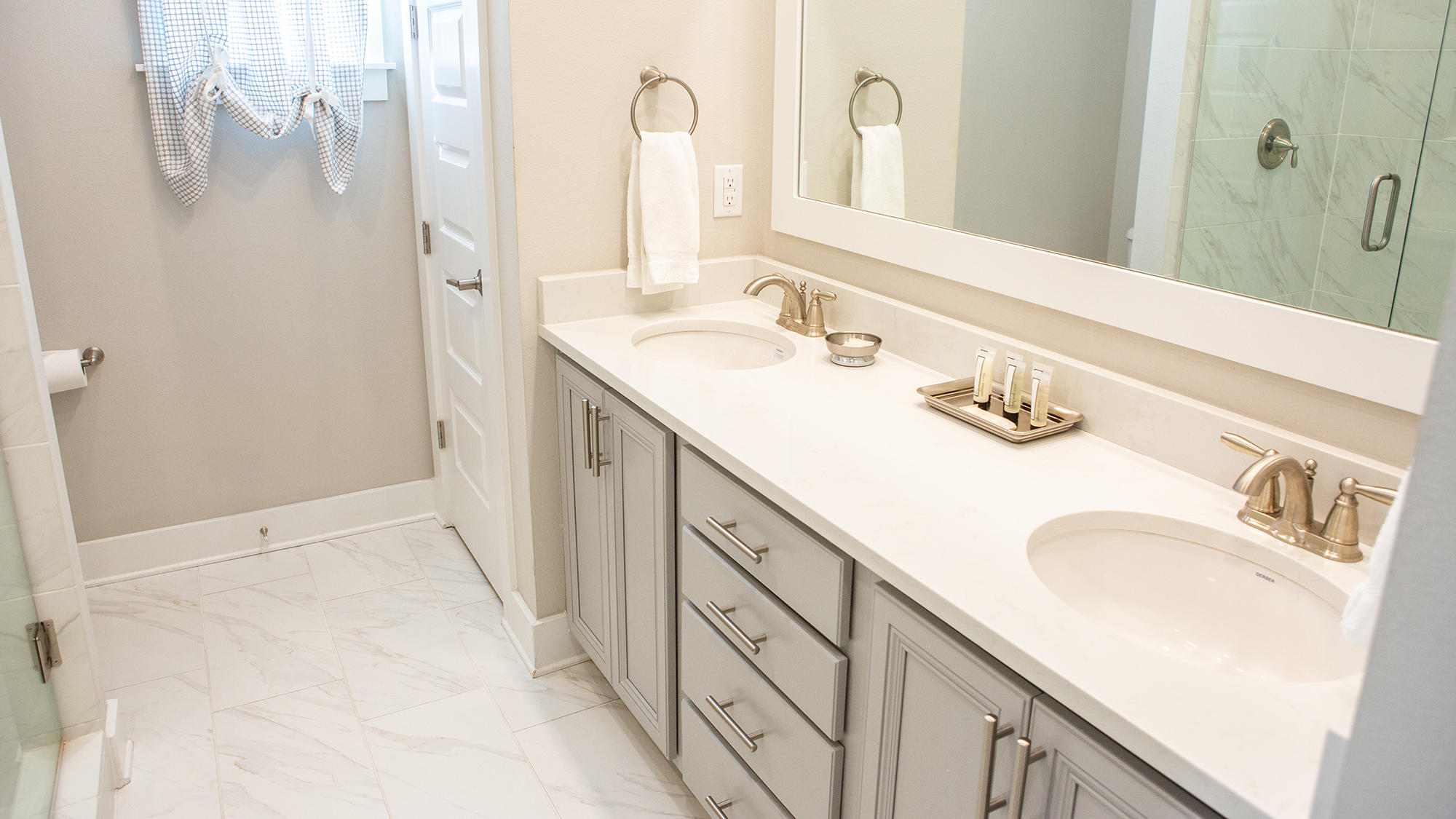 51 Dune Comet Lane, Unit A Panama City Beach, FL 32461 - Photo 14 of 63 a bathroom with a sink and a mirror