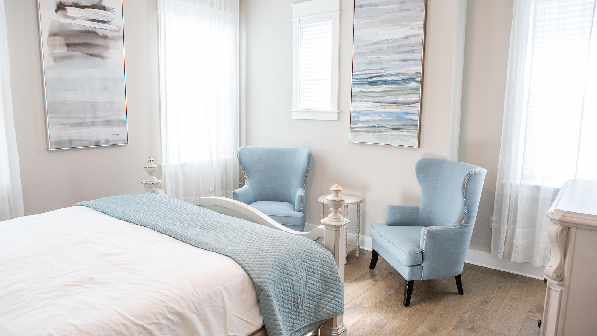 51 Dune Comet Lane, Unit A Panama City Beach, FL 32461 - Photo 17 of 63 a bedroom with a bed and a chair