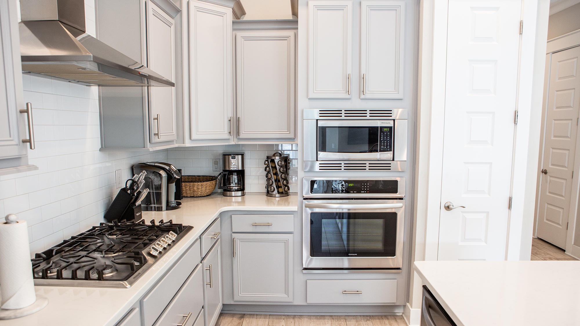 51 Dune Comet Lane, Unit A Panama City Beach, FL 32461 - Photo 3 of 63 a kitchen with stainless steel appliances granite countertop a stove and a refrigerator