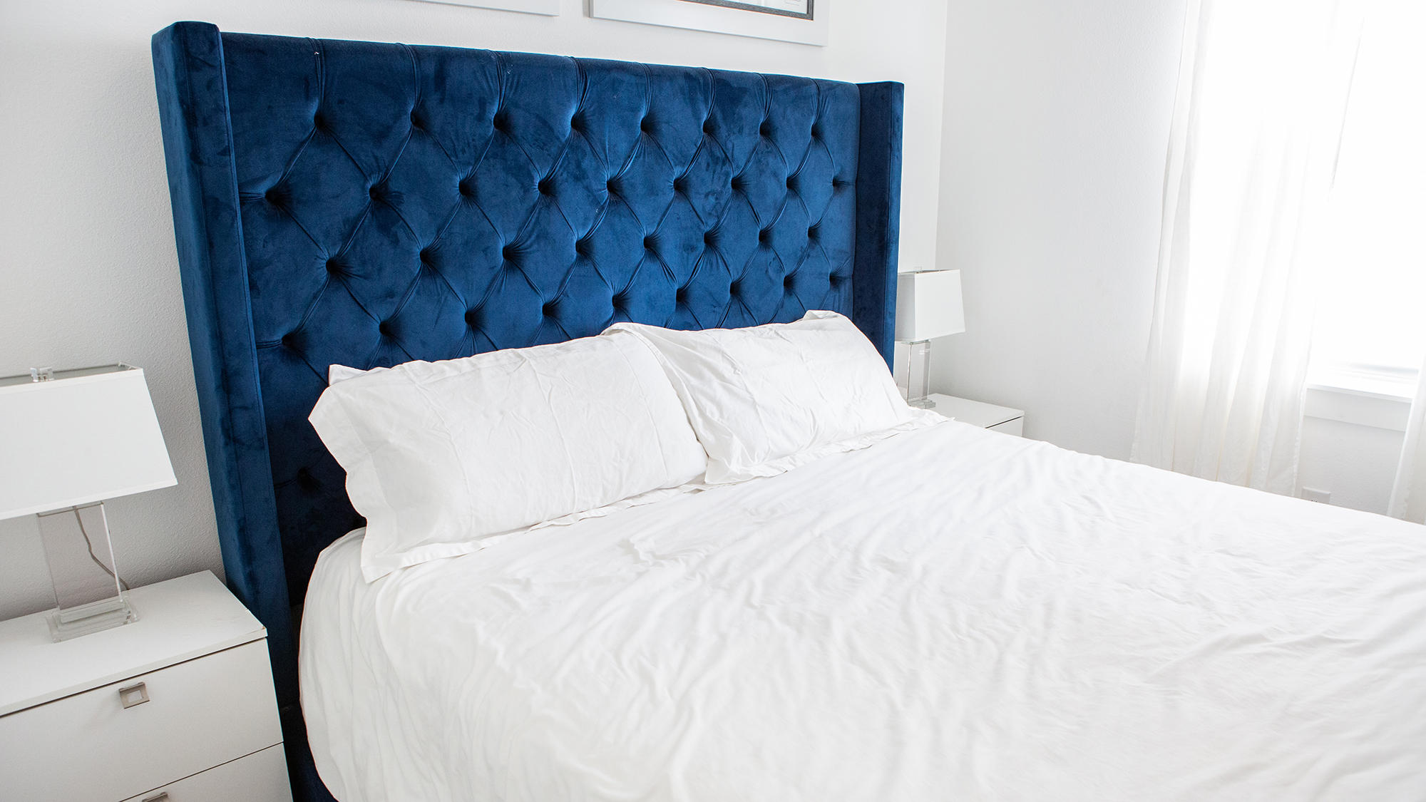 51 Dune Comet Lane, Unit A Panama City Beach, FL 32461 - Photo 24 of 63 a bed sitting in a bedroom and wooden floor