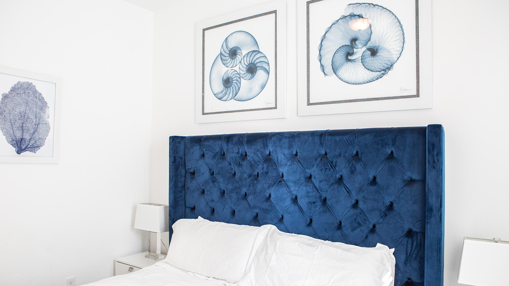 51 Dune Comet Lane, Unit A Panama City Beach, FL 32461 - Photo 25 of 63 a bathroom with a toilet and a picture on the wall