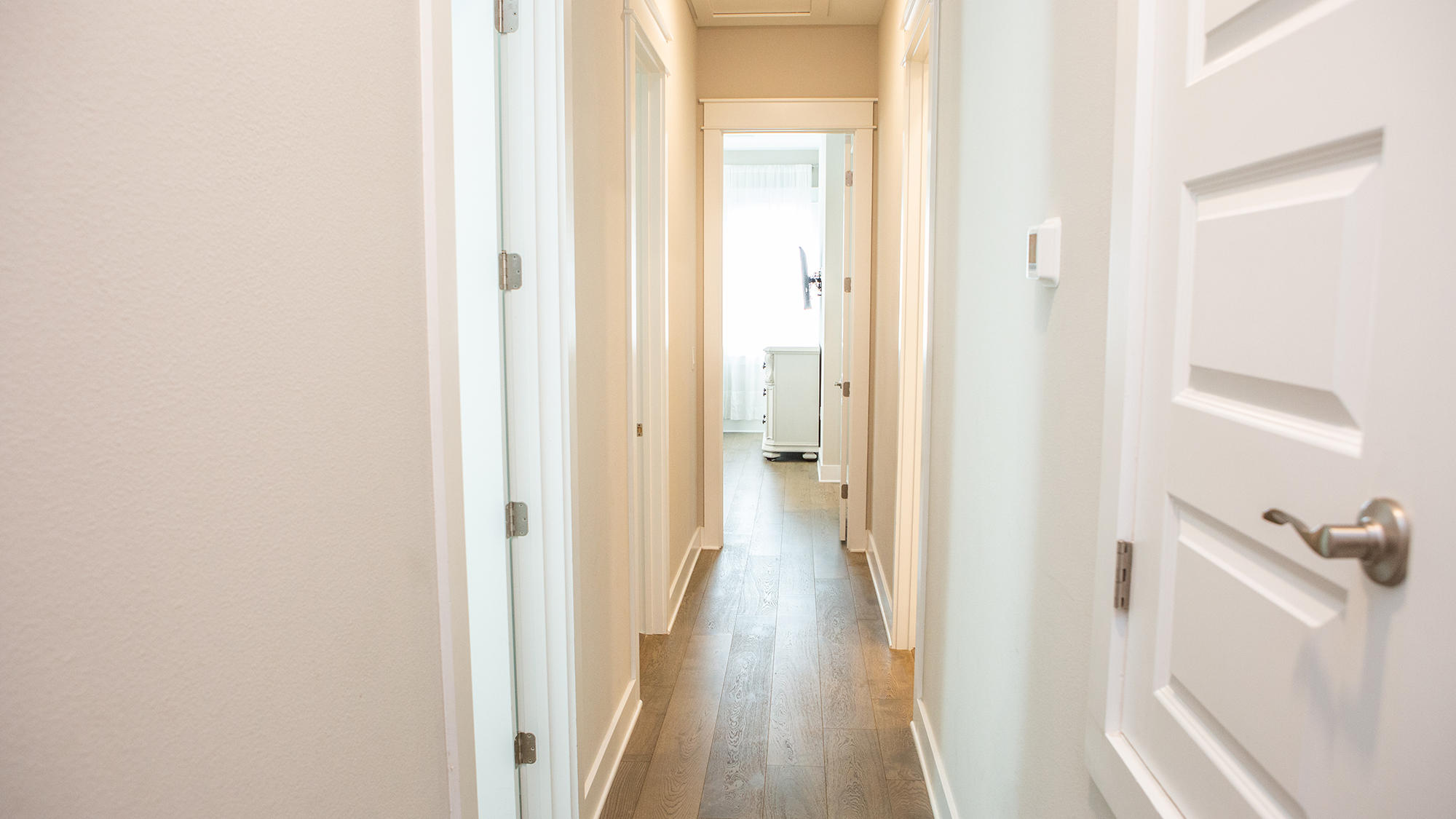 51 Dune Comet Lane, Unit A Panama City Beach, FL 32461 - Photo 26 of 63 a view of a hallway with wooden floor