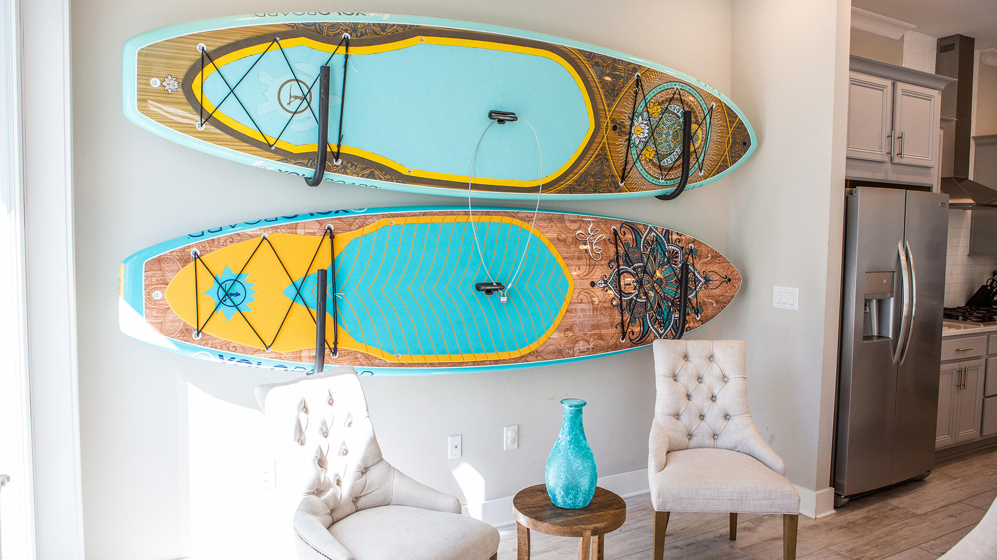 51 Dune Comet Lane, Unit A Panama City Beach, FL 32461 - Photo 5 of 63 a picture of a living room with a baby crib and a wooden floor