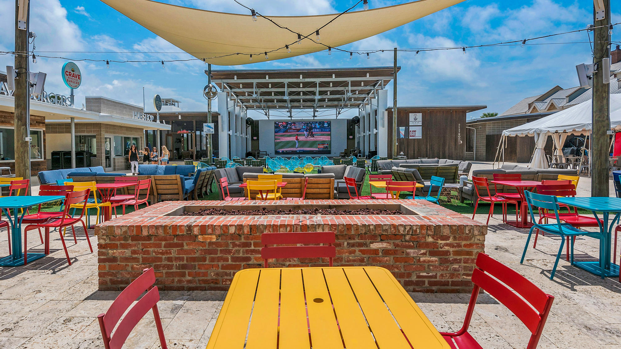 51 Dune Comet Lane, Unit A Panama City Beach, FL 32461 - Photo 47 of 63 a outdoor seating area with a table and chairs