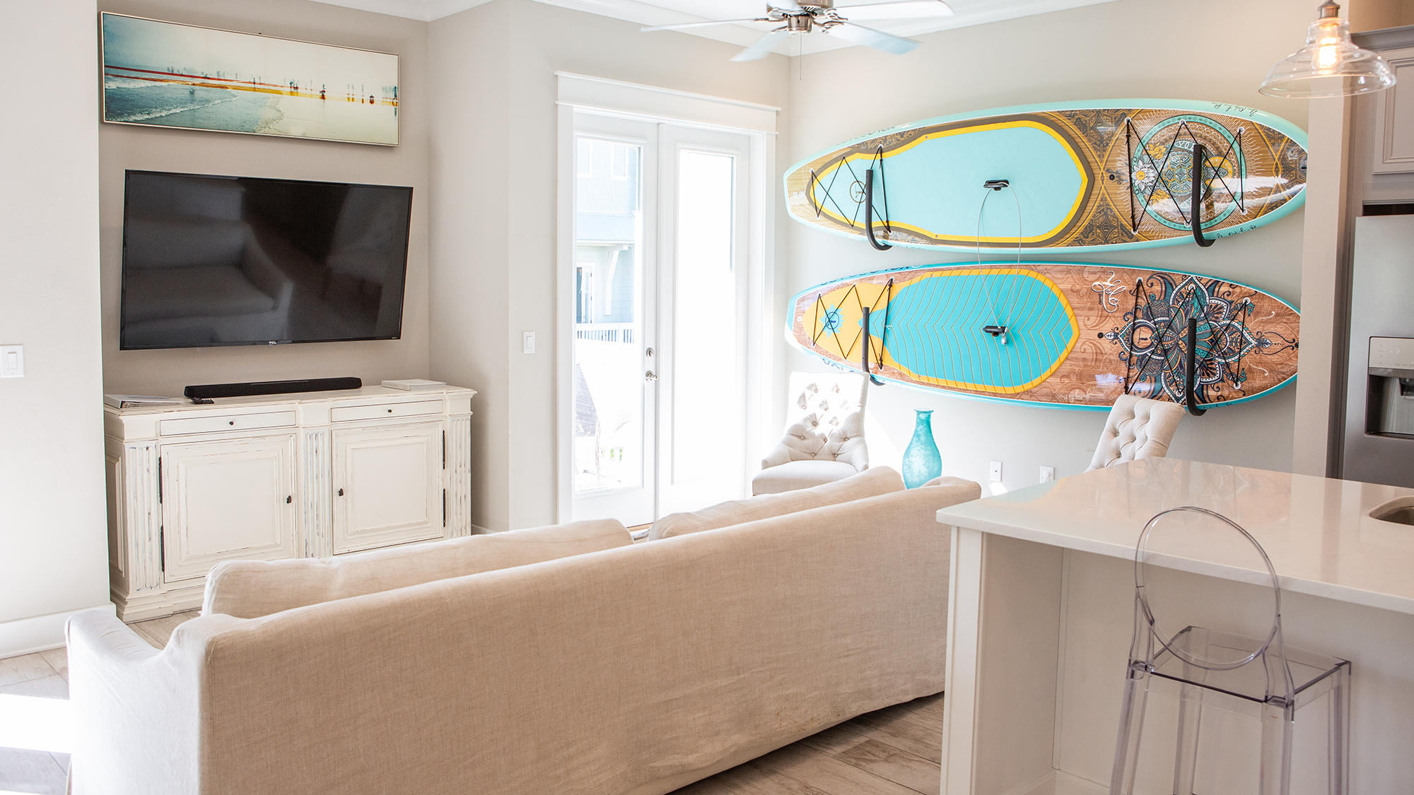 51 Dune Comet Lane, Unit A Panama City Beach, FL 32461 - Photo 6 of 63 a living room with furniture and a flat screen tv