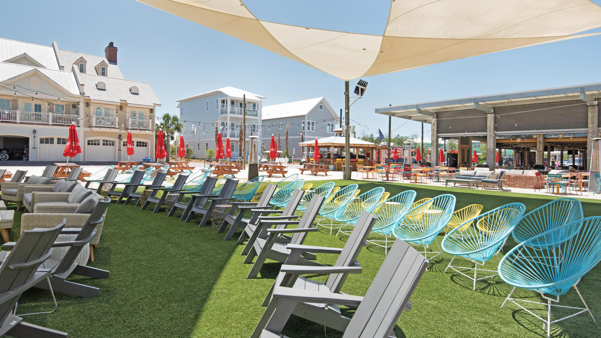 51 Dune Comet Lane, Unit A Panama City Beach, FL 32461 - Photo 52 of 63 a view of a chairs and tables in patio
