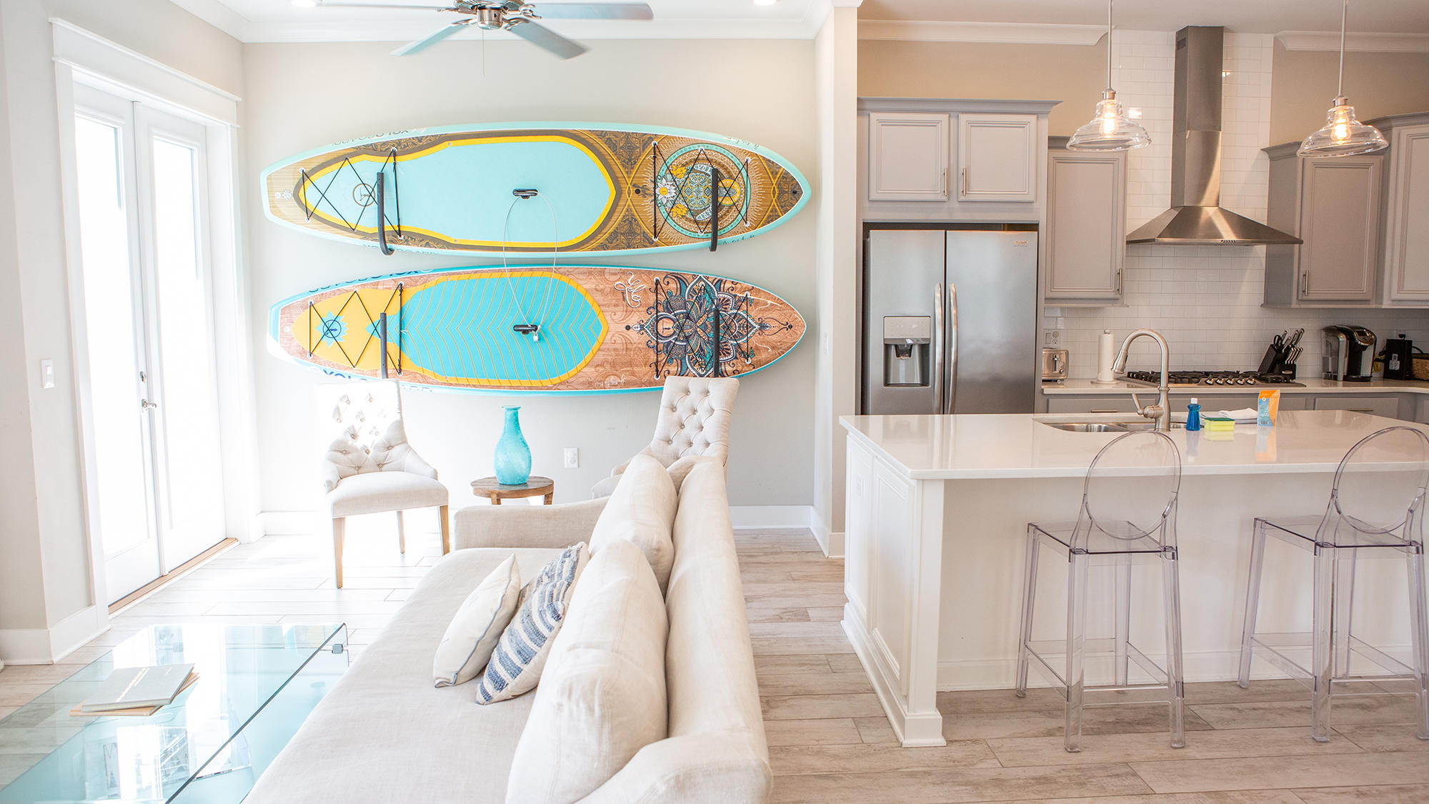 51 Dune Comet Lane, Unit A Panama City Beach, FL 32461 - Photo 7 of 63 a kitchen with a sink a stove and a dining table