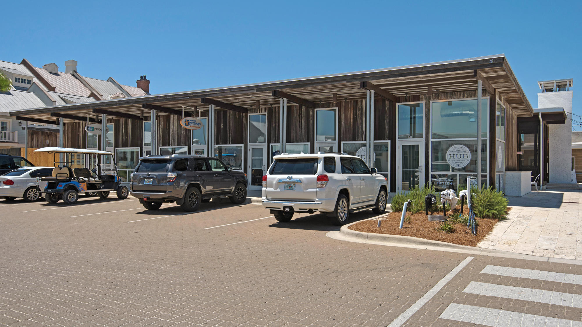 51 Dune Comet Lane, Unit A Panama City Beach, FL 32461 - Photo 61 of 63 a car parked in front of a house