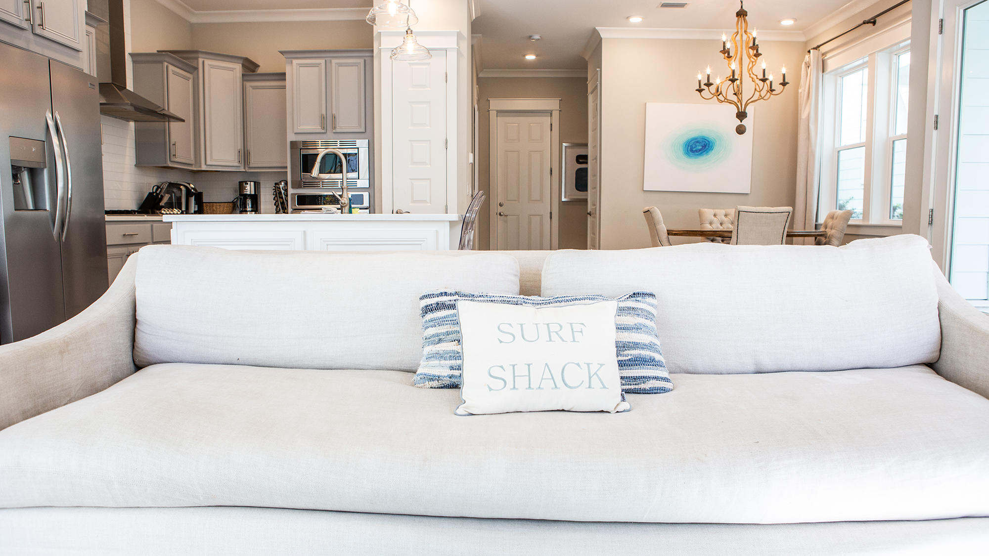 51 Dune Comet Lane, Unit A Panama City Beach, FL 32461 - Photo 8 of 63 a white bed sitting in a kitchen next to a window