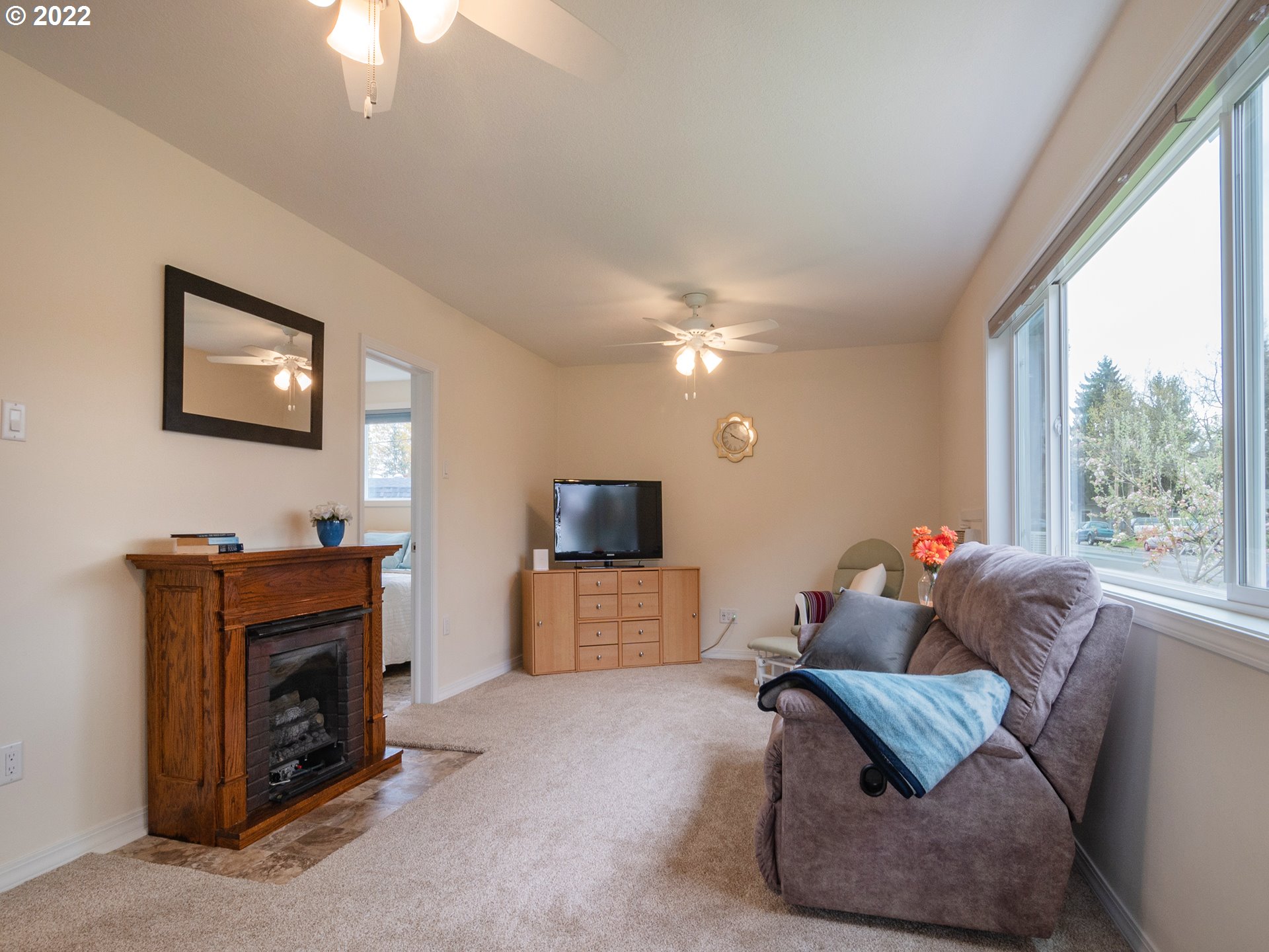 1340 E Street Springfield, OR 97477 - Photo 12 of 32 a living room with furniture and a fireplace