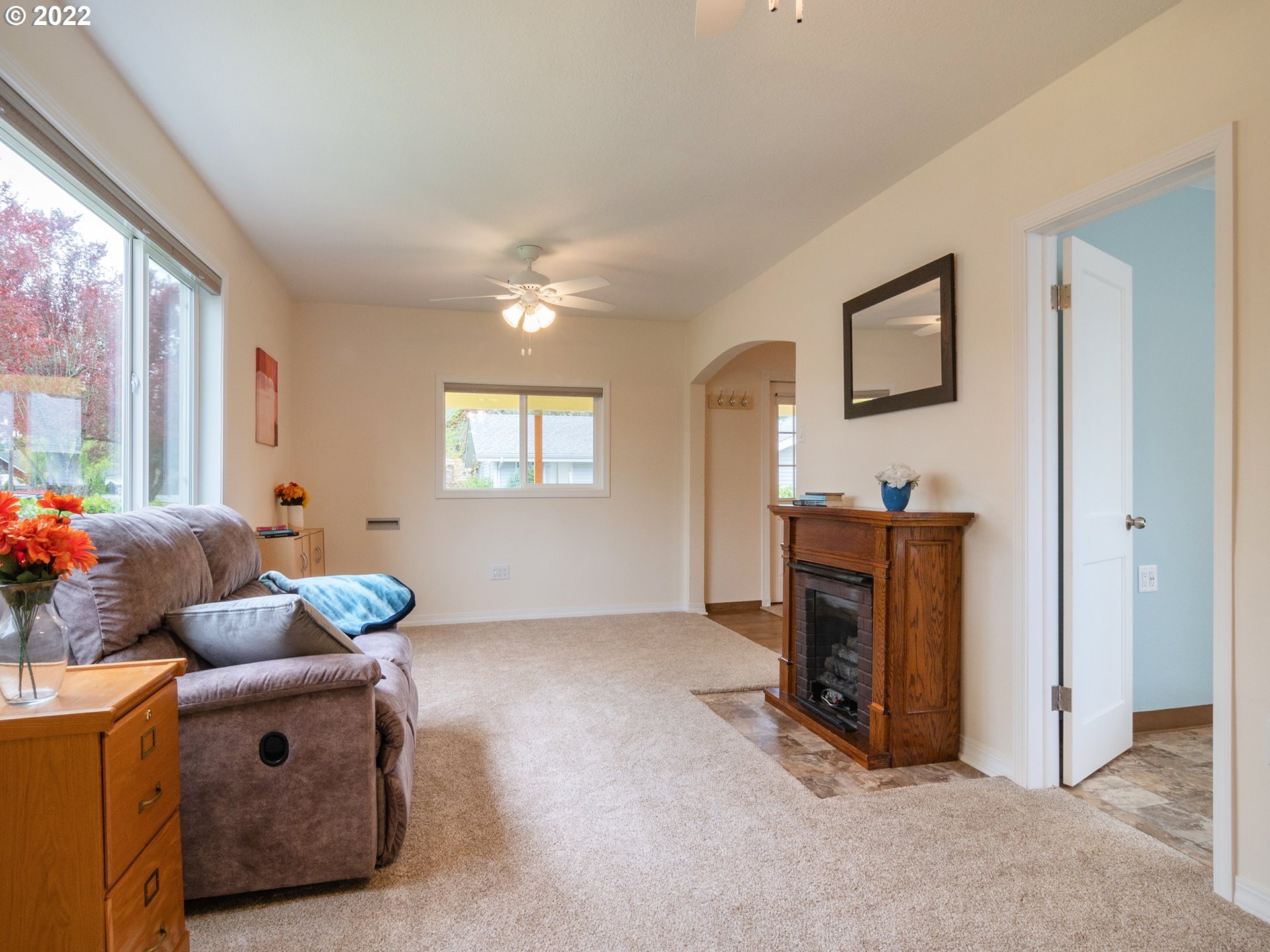 1340 E Street Springfield, OR 97477 - Photo 14 of 32 a living room with furniture and a fireplace