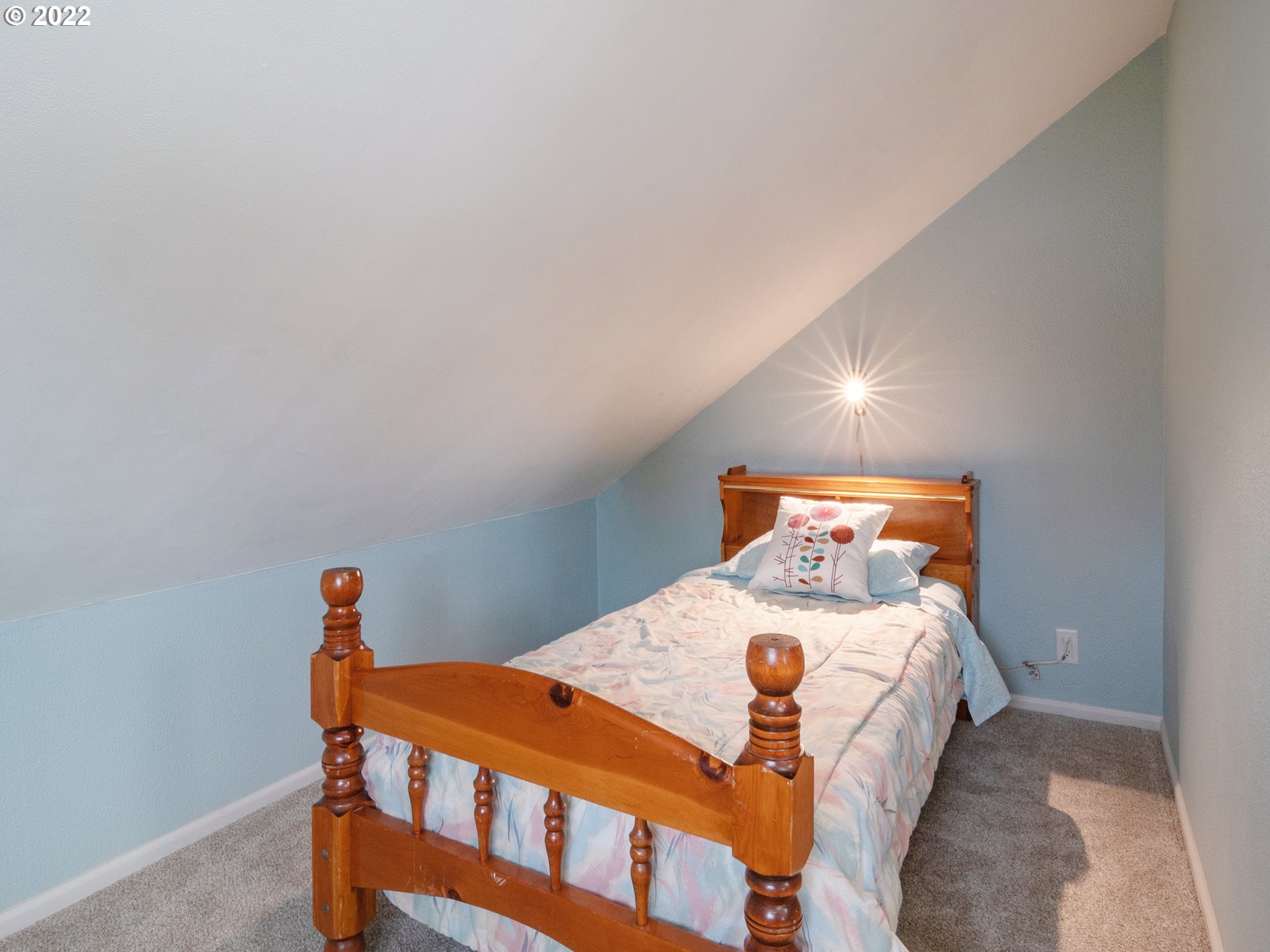 1340 E Street Springfield, OR 97477 - Photo 19 of 32 a bedroom with a bed and small furniture