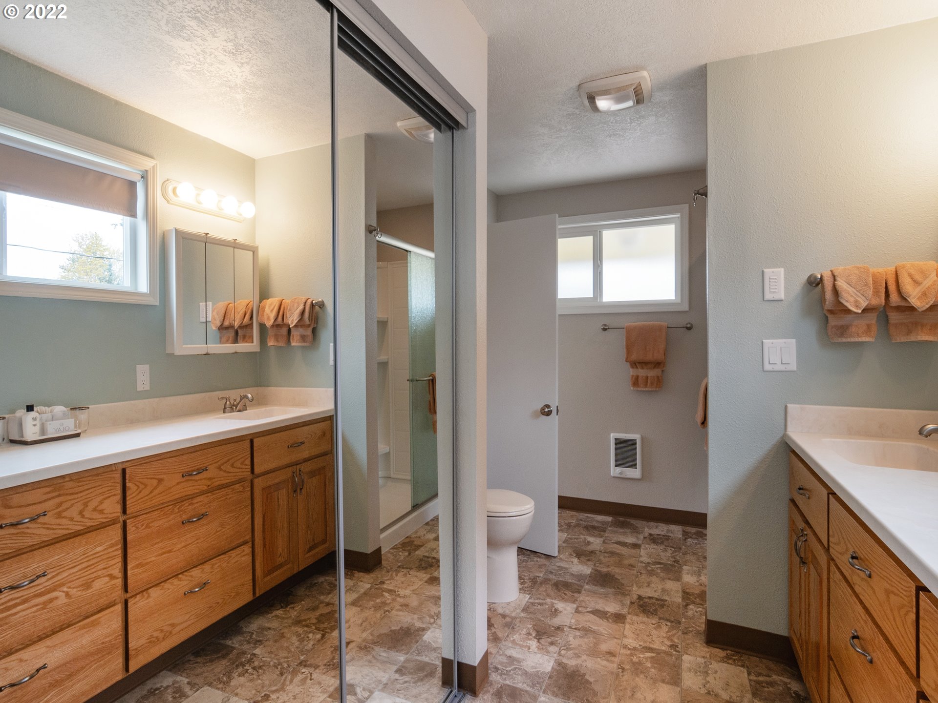 1340 E Street Springfield, OR 97477 - Photo 22 of 32 a spacious bathroom with a sink and a mirror