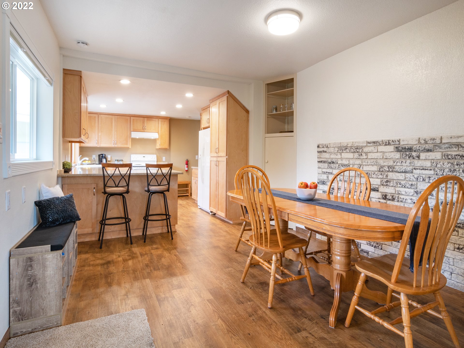 1340 E Street Springfield, OR 97477 - Photo 4 of 32 a view of a dining room with furniture and wooden floor
