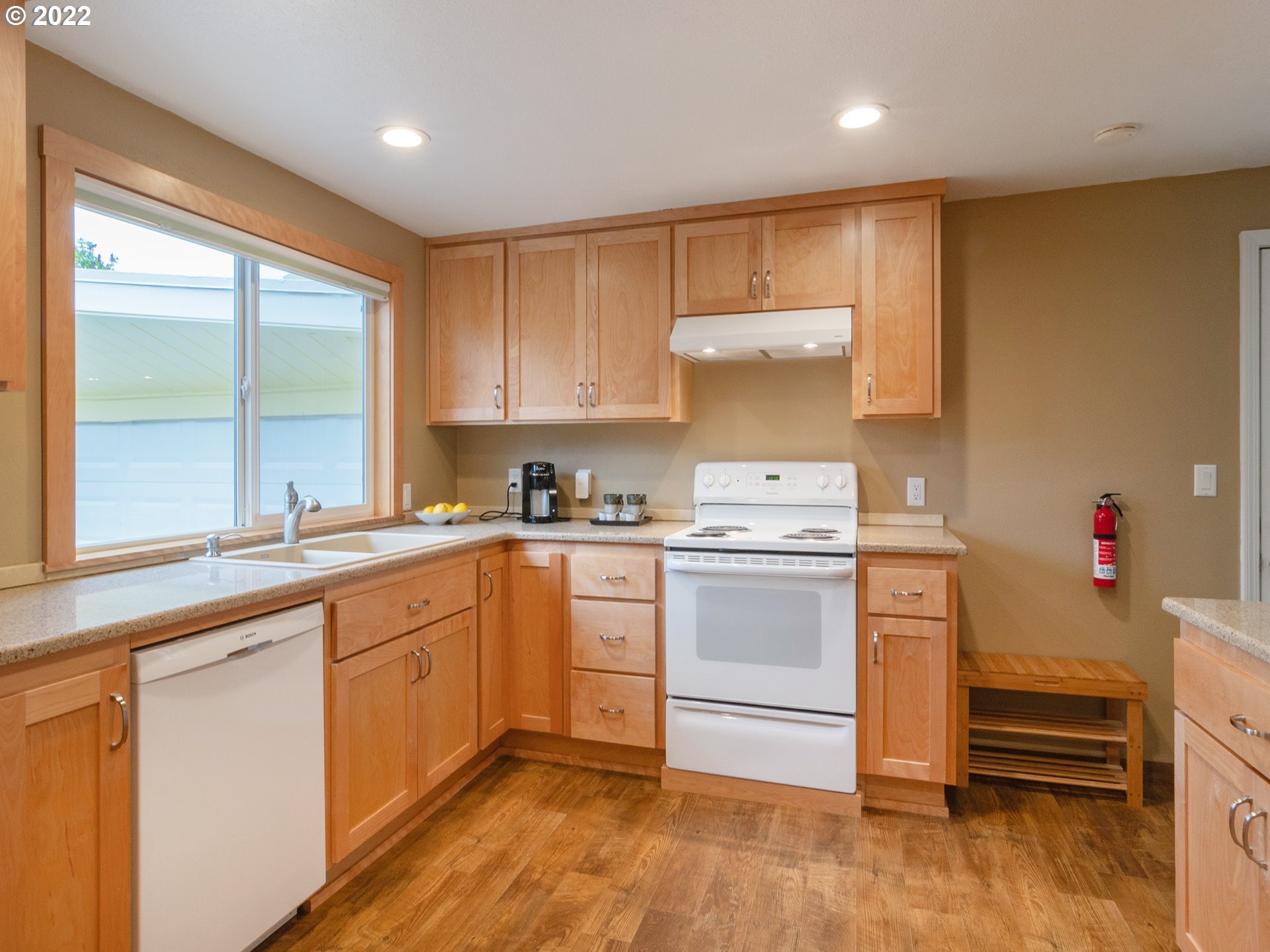 1340 E Street Springfield, OR 97477 - Photo 8 of 32 a kitchen with a sink cabinets and wooden floor