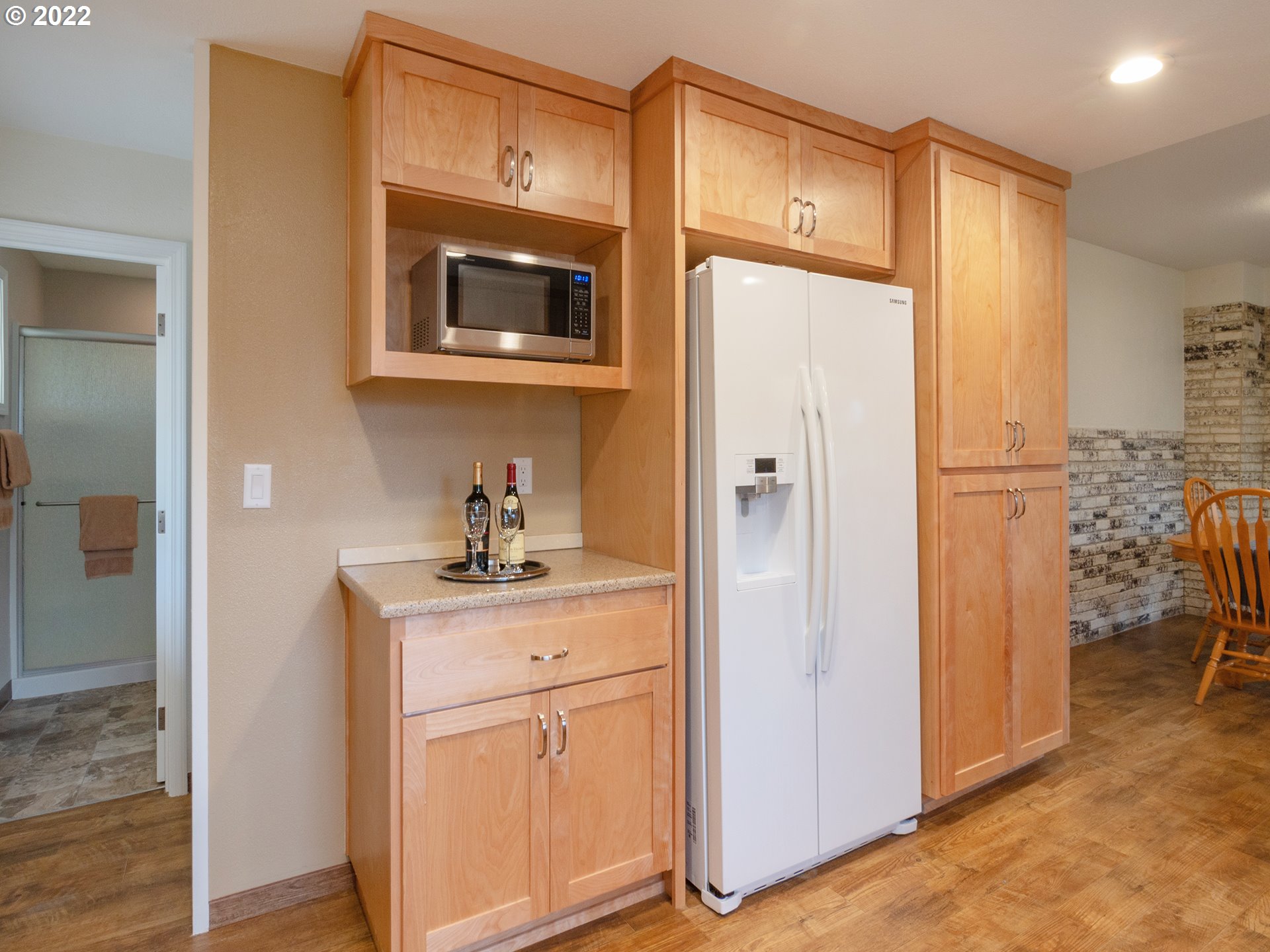 1340 E Street Springfield, OR 97477 - Photo 9 of 32 a kitchen with a refrigerator a sink and cabinets