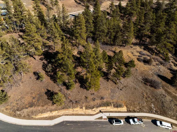 a view of a backyard with table and chairs