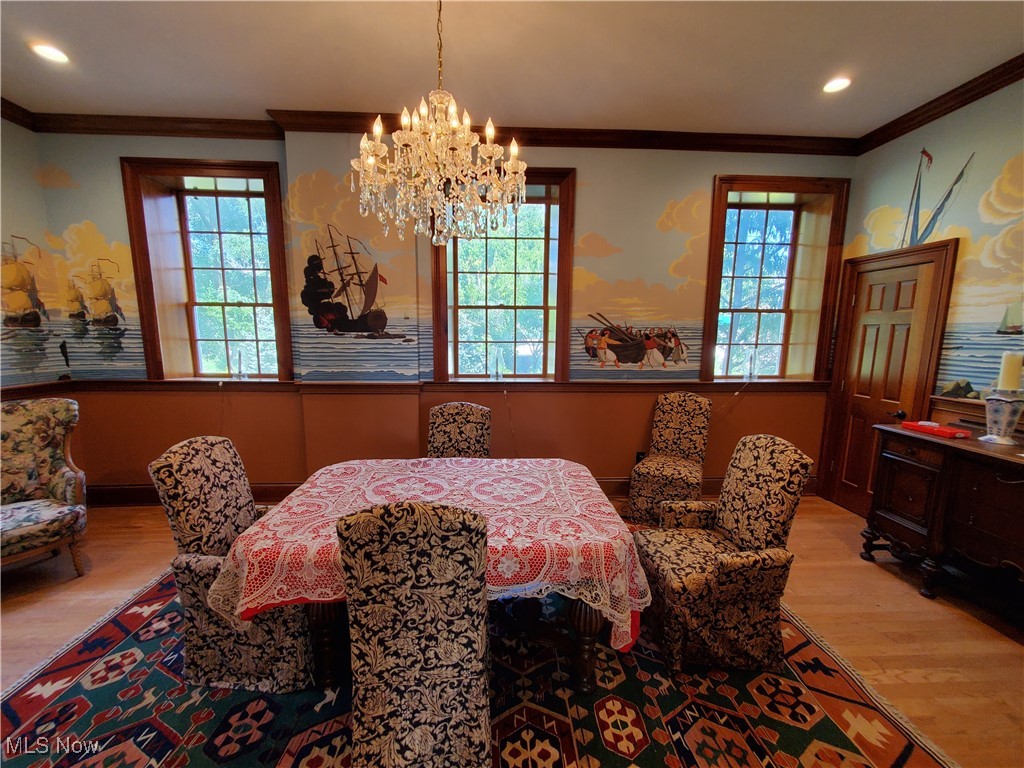 150 Main Street Hayesville, OH 44805 - Photo 15 of 50 Dining space with crown molding, wood finished floors, a chandelier, and recessed lighting