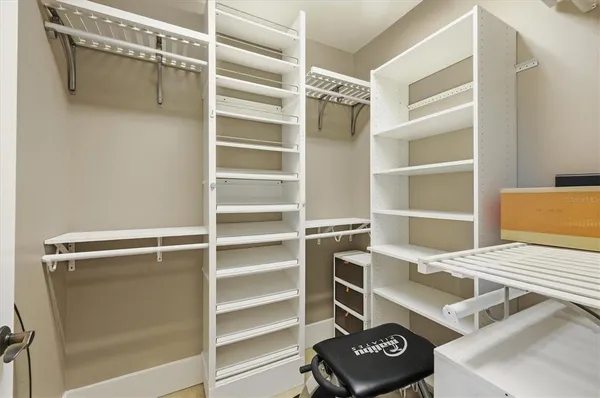 a bathroom with a granite countertop sink a toilet a mirror and shower