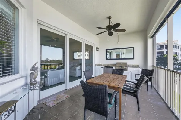 a view of a balcony with furniture