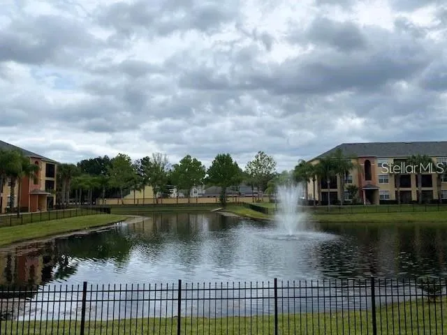 a view of a lake with a yard