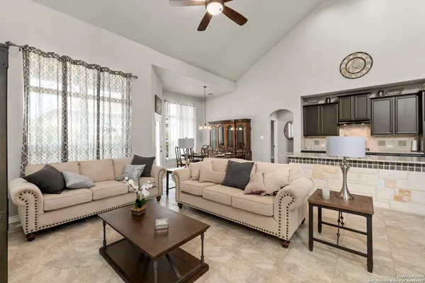a living room with furniture and a large window