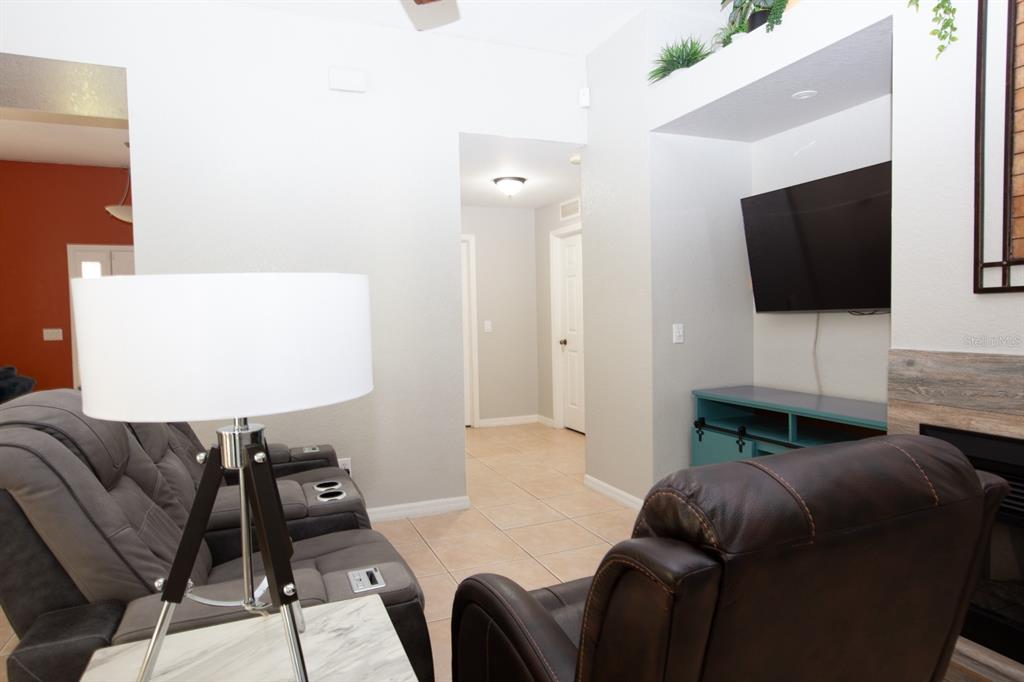 11617 Brookmore Way Riverview, FL 33569 - Photo 22 of 42 a living room with furniture and a flat screen tv