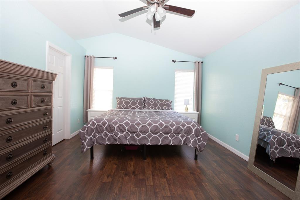 11617 Brookmore Way Riverview, FL 33569 - Photo 25 of 42 a bedroom with a bed and a dresser
