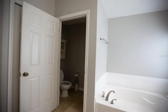 a bathroom with a tub and a sink