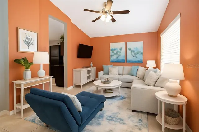 a living room with furniture and a flat screen tv