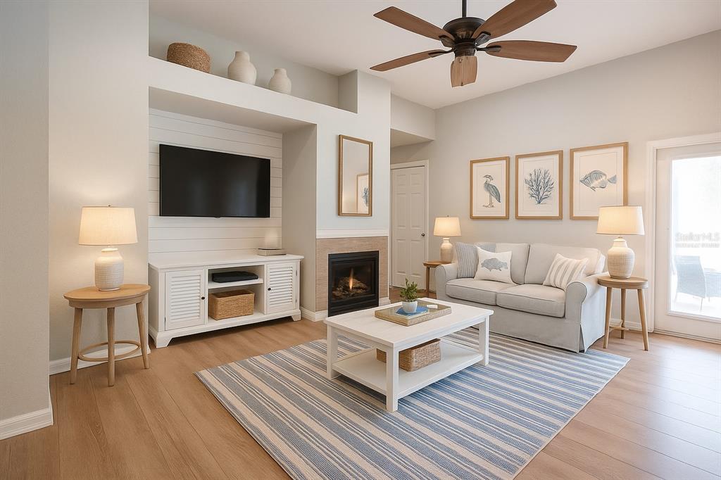 11617 Brookmore Way Riverview, FL 33569 - Photo 5 of 42 a living room with furniture a fireplace and a flat screen tv