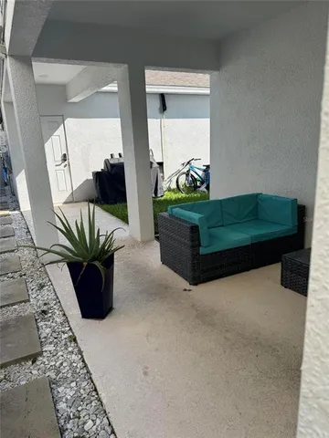 a living room filled with furniture and a rug