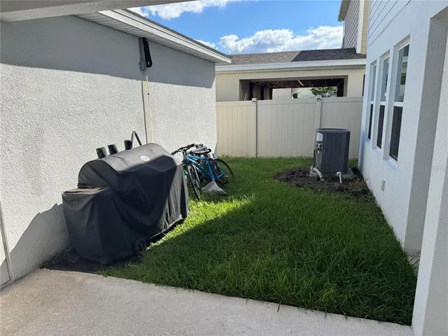 a bathroom with a granite countertop sink toilet and a mirror
