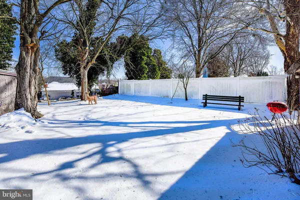 a view of a house with snow on the tree