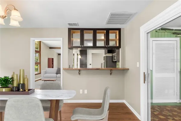 a dining room with furniture and window