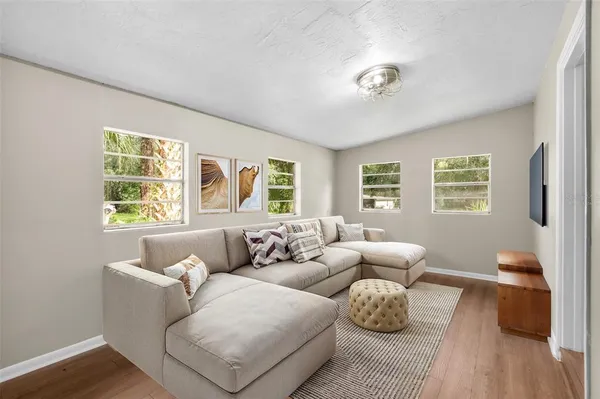 a living room with furniture and a window